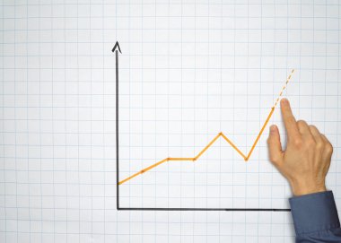 İşadamı Puan bir grafik üzerinde bir flipchart - kavramı ile yıkayın boşaltmak