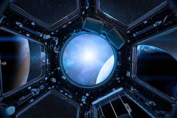 View from a porthole of space station on the Earth background. — Stock Photo, Image