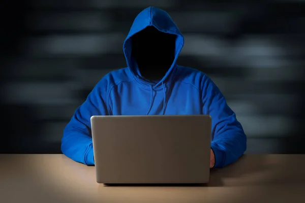 Computer hacker steals data from laptop.