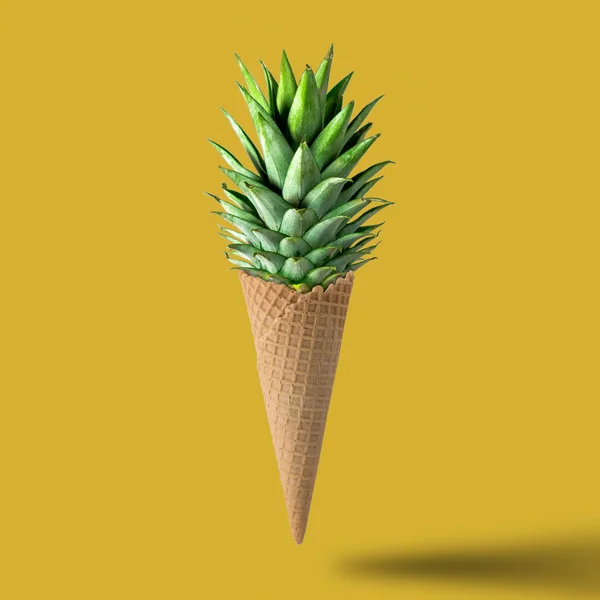 Ice cream cone with pineapple leaves on bright yellow background — Stock Photo, Image