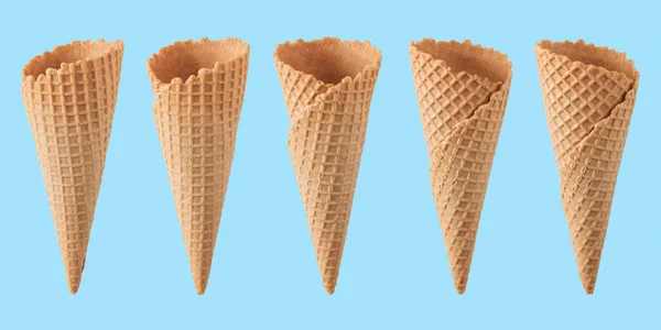 Various ice cream cones isolated on blue background. — Stock Photo, Image