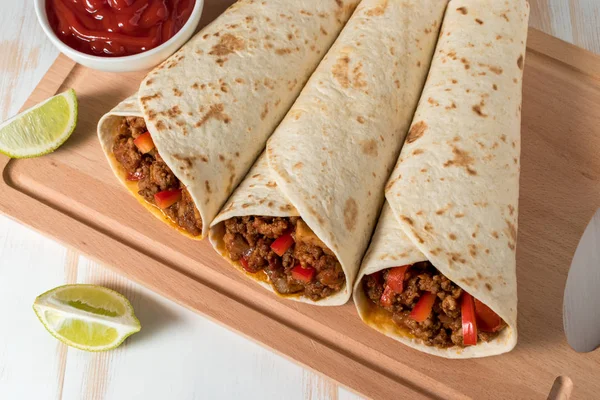 Tasty homemade burrito with vegetables and beef — Stock Photo, Image