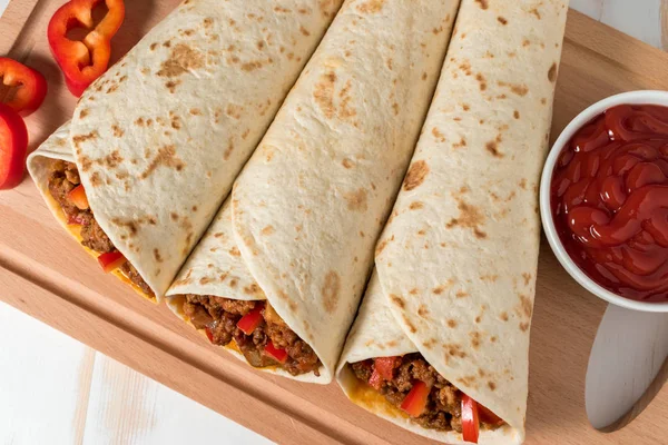 Tasty homemade burrito with vegetables and beef — Stock Photo, Image