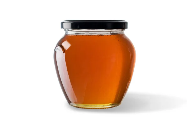 Μέλι σε βάζο που απομονώνονται σε λευκό φόντο. — Φωτογραφία Αρχείου