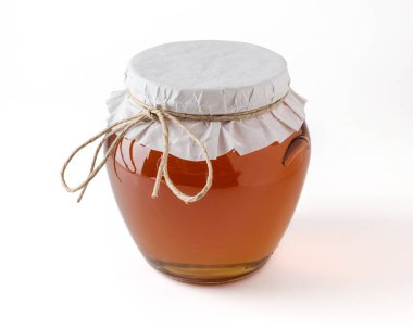 Beyaz arka plan üzerinde kavanoza tatlım.