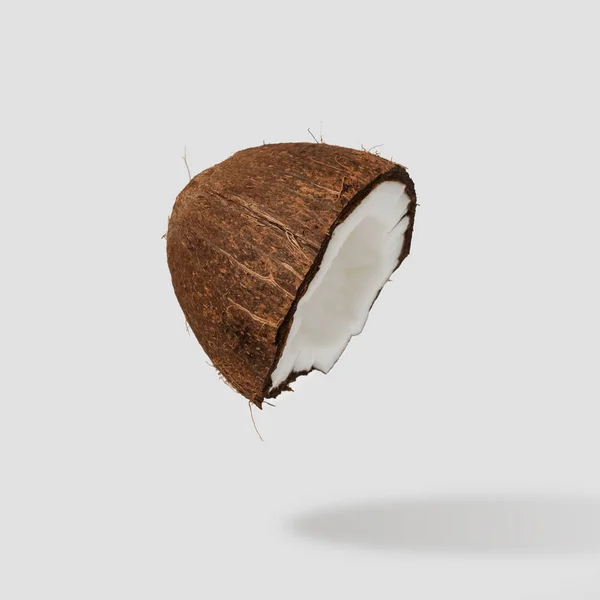 Gebarsten kokos half op lichte achtergrond. — Stockfoto