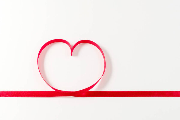 Heart made of ribbon on white background. Valentines day.
