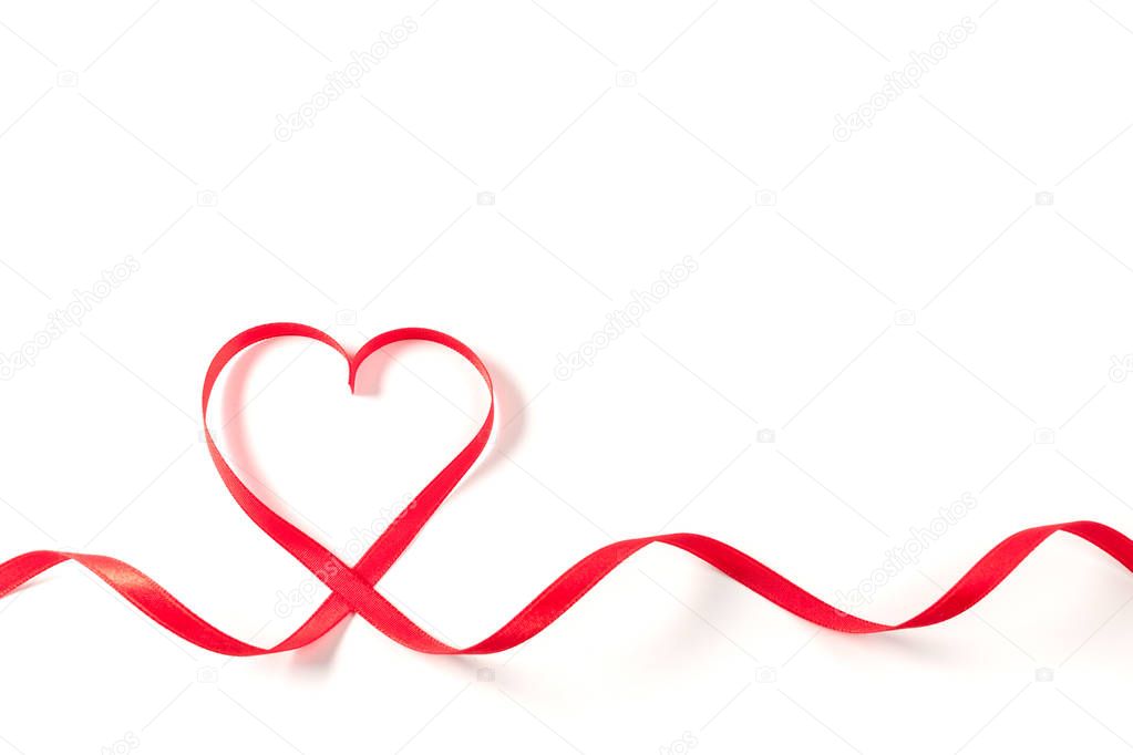 Heart made of ribbon on white background. Valentines day.