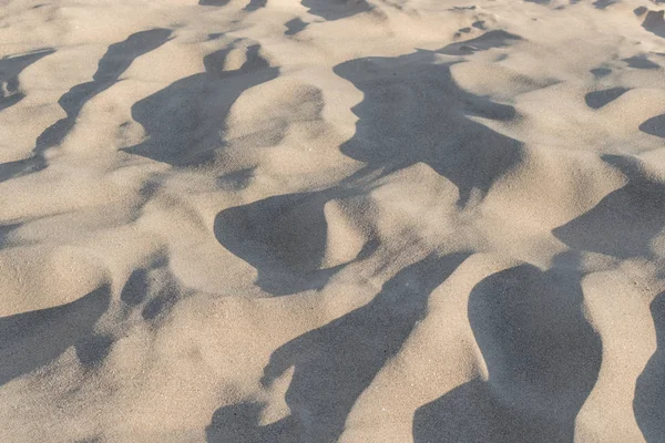 Fechamento de padrão de areia de uma praia no verão — Fotografia de Stock