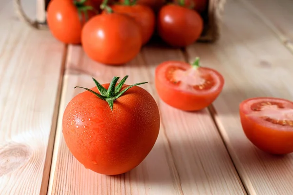 Close-up of fresh, ripe tomatoes on wooden background. — Stock Photo, Image