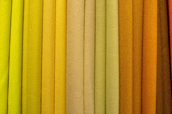 Multicolored Folded Fabric Texture Pile Bright Folded Fabric Clothes Stock Photo
