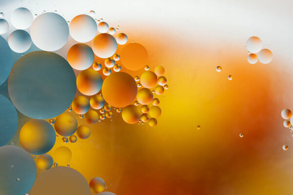 Abstract colorful backdrop with oil drops on water surface. Abstract background.