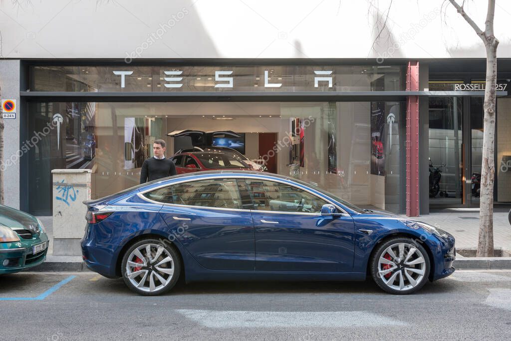 Barcelona, Spain -March 14, 2019: Tesla cars store near Passeig de Gracia luxury shopping street with Tesla electric car model 3.