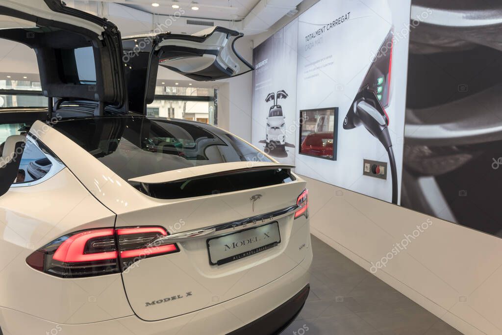 Barcelona, Spain -March 14, 2019: Tesla cars store near Passeig de Gracia luxury shopping street with Tesla electric car model X inside.
