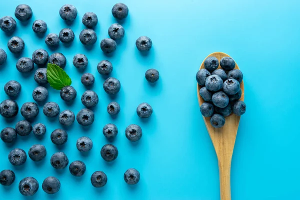 Tasty Ripe Blueberries Blue Background Spoon Minimal Food Concept Flat — Stock Photo, Image