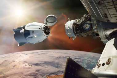 Alçak Dünya yörüngesinde kargo uzay aracı. Bu görüntünün elementleri NASA tarafından desteklenmektedir.