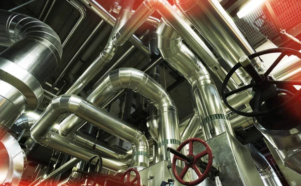 Different size and shaped pipes and valves at a power plant — Stock Photo, Image