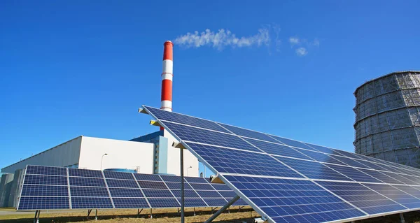 Solar panel, smokestack and water cooler at power plant — Stock Photo, Image