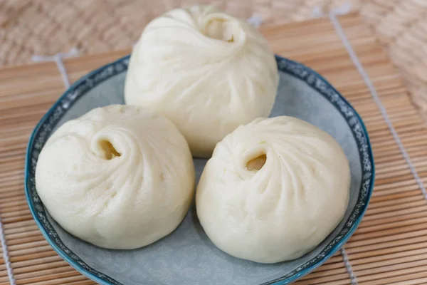 Three buns on the blue plate, — Stock Photo, Image