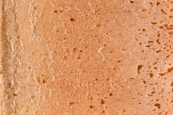 Abstraktní close-up kůra bílého chleba pozadí textury — Stock fotografie