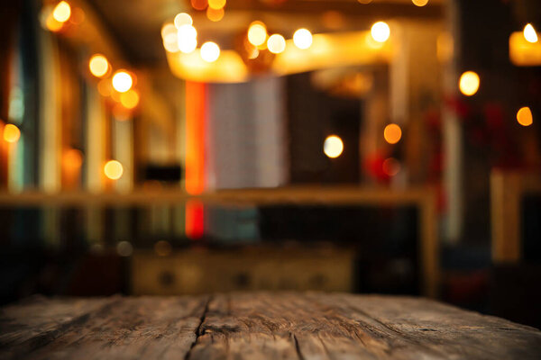 wood table on blur backgroun of club or restaurant