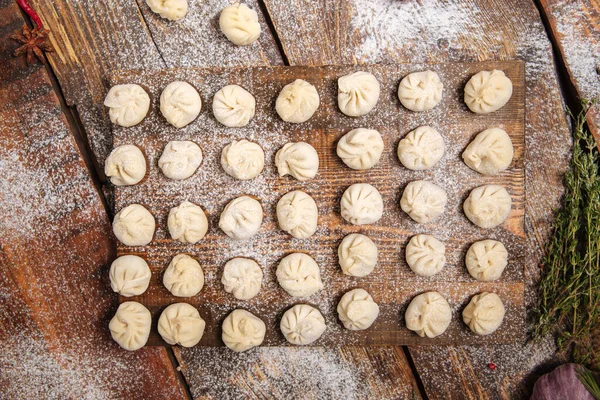 Semi-finished homemade dumplings pelmeni — Stock Photo, Image