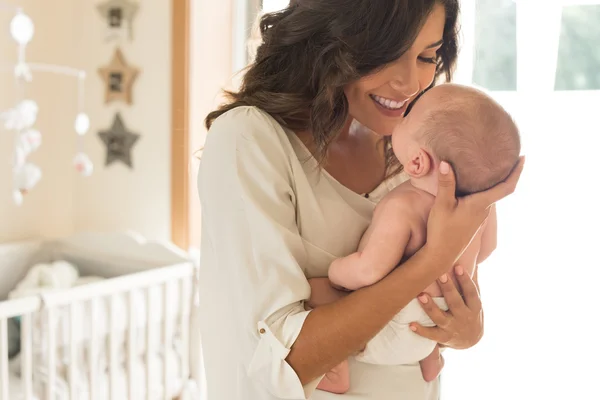 Mother with baby in arms