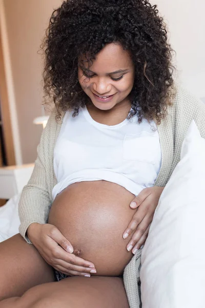 Pregnant woman touching her belly — Stock Photo, Image