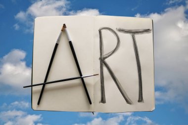 Art with paint brushes spelled out clipart