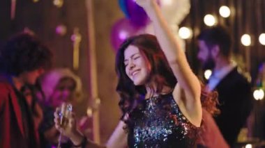 Good looking beautiful and charismatic group of friends have a big party glamorous dancing and enjoying the time