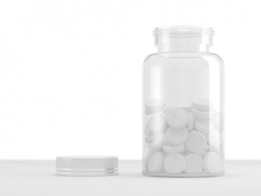 Beyaz arka plan üzerinde beyaz tabletler ile şeffaf şişe