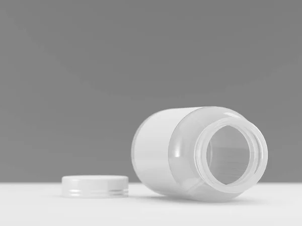 Empty medicine can lying on table on dark background