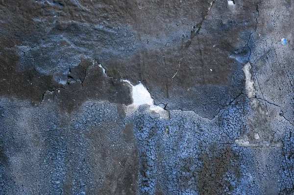 Scheuren in het oude betonnen muur blauw — Stockfoto