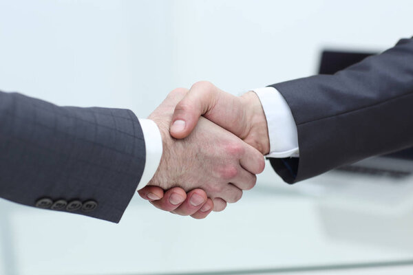 Business people shaking hands after good deal