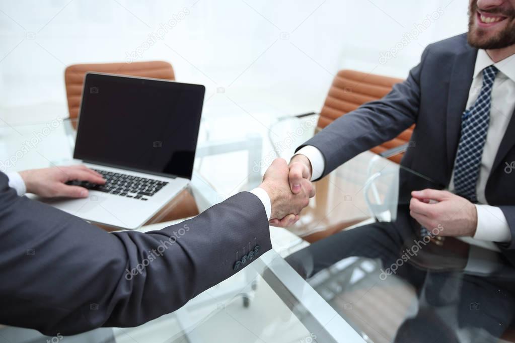 Business people shaking hands after good deal
