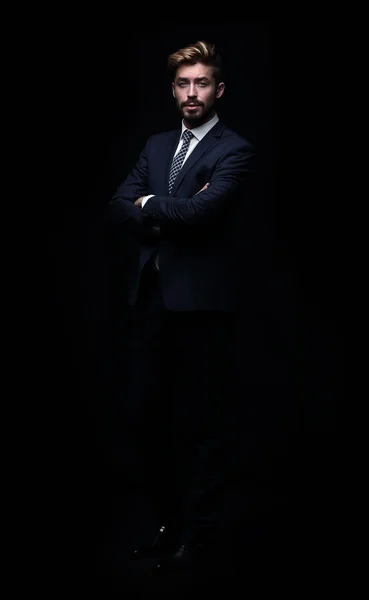 Retrato de homem de negócios jovem e bonito isolado em preto Imagens Royalty-Free
