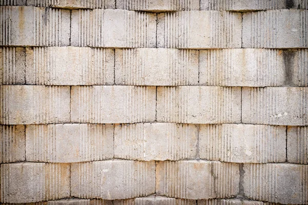 Šedý texturovaný cihlová zeď — Stock fotografie