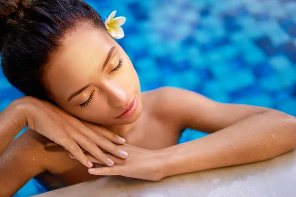 Young woman in spa pool