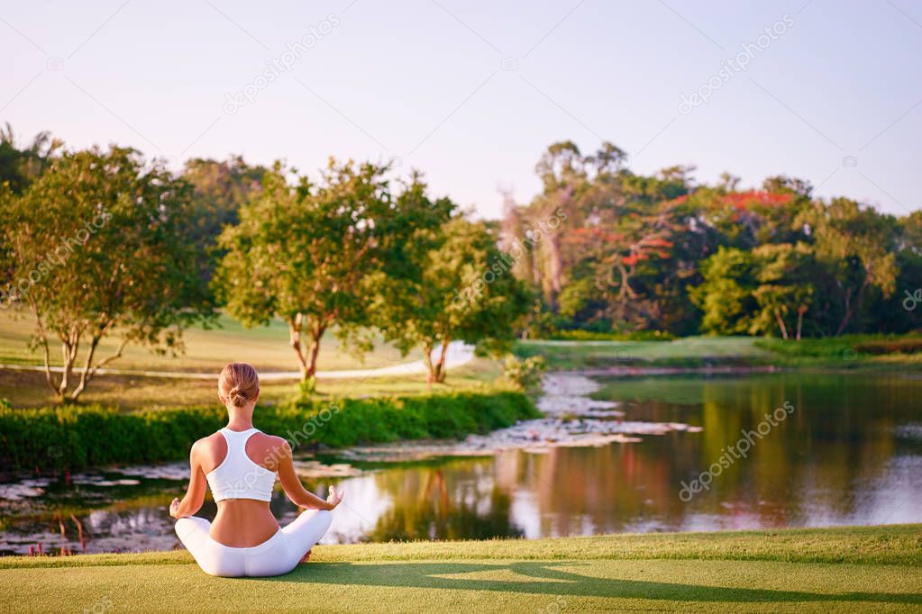 Young woman in lotus pose 