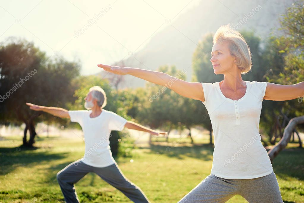 Senior family exercising outdoors