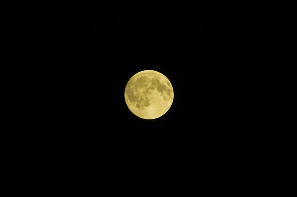 Luna piena sul nero Fotografia Stock