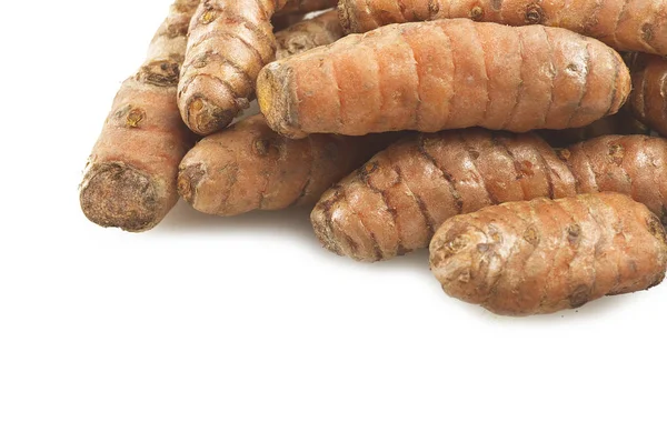 Radice di curcuma e alcune fette — Foto Stock