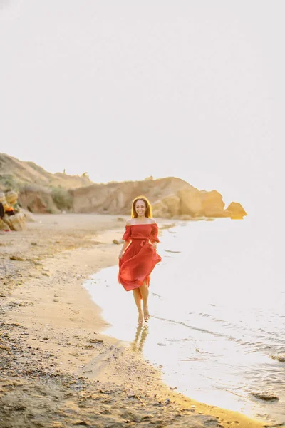 Beautiful young girl in red dress — Stock Photo, Image