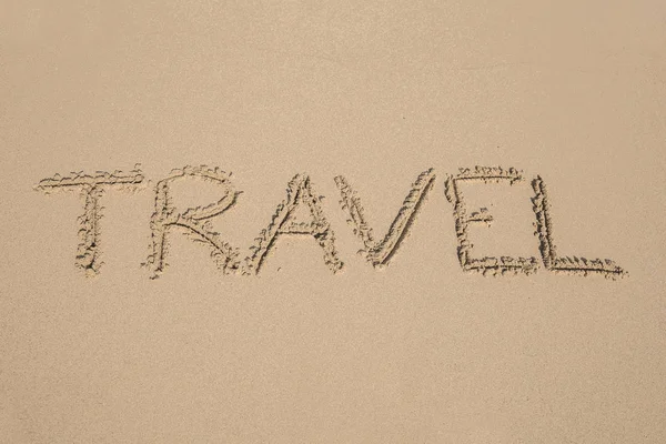 The Word 'travel' Written in Sand Background — Stock Photo, Image