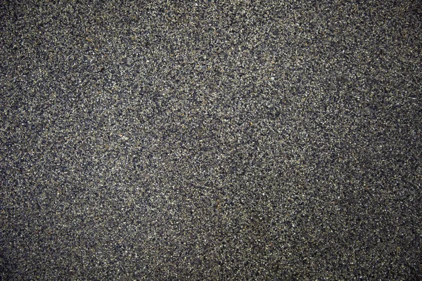 Pavimento de fundo abstrato constituído por pequenos seixos embutidos em cimento — Fotografia de Stock