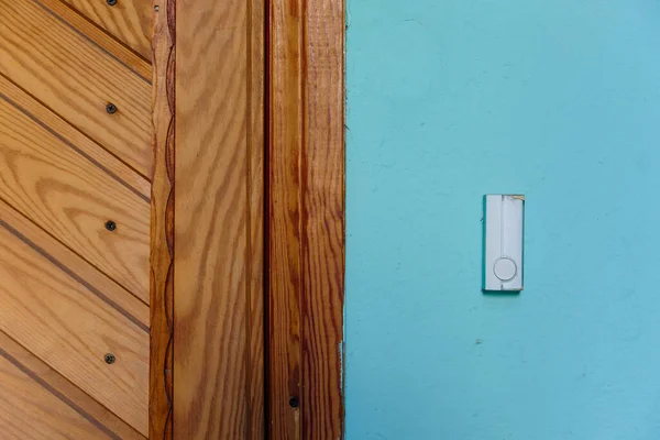 bell switch button on the wall with door