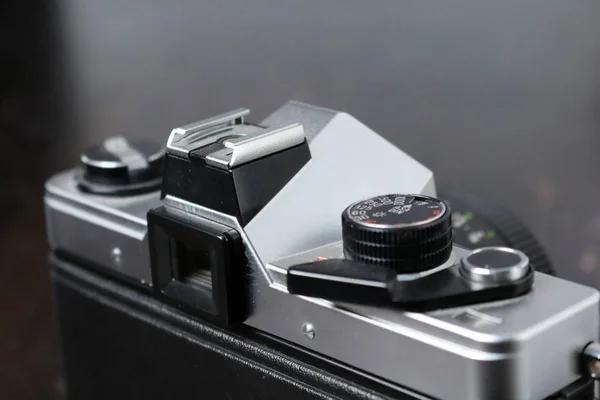 Vintage Photo Camera on a brown wooden surface — Stock Photo, Image