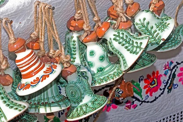 Ceramic bells hanging from a rope, traditional decorated — Stock Photo, Image