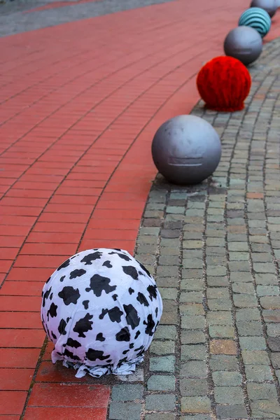 Street pavement with ornamental metallic balls — Stock Photo, Image