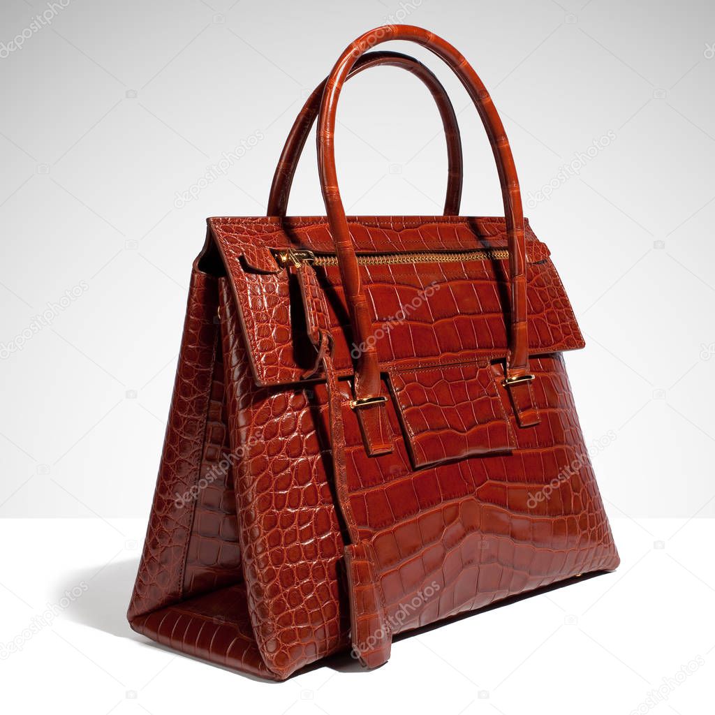 Leather crocodile bag luxury brown on a white background